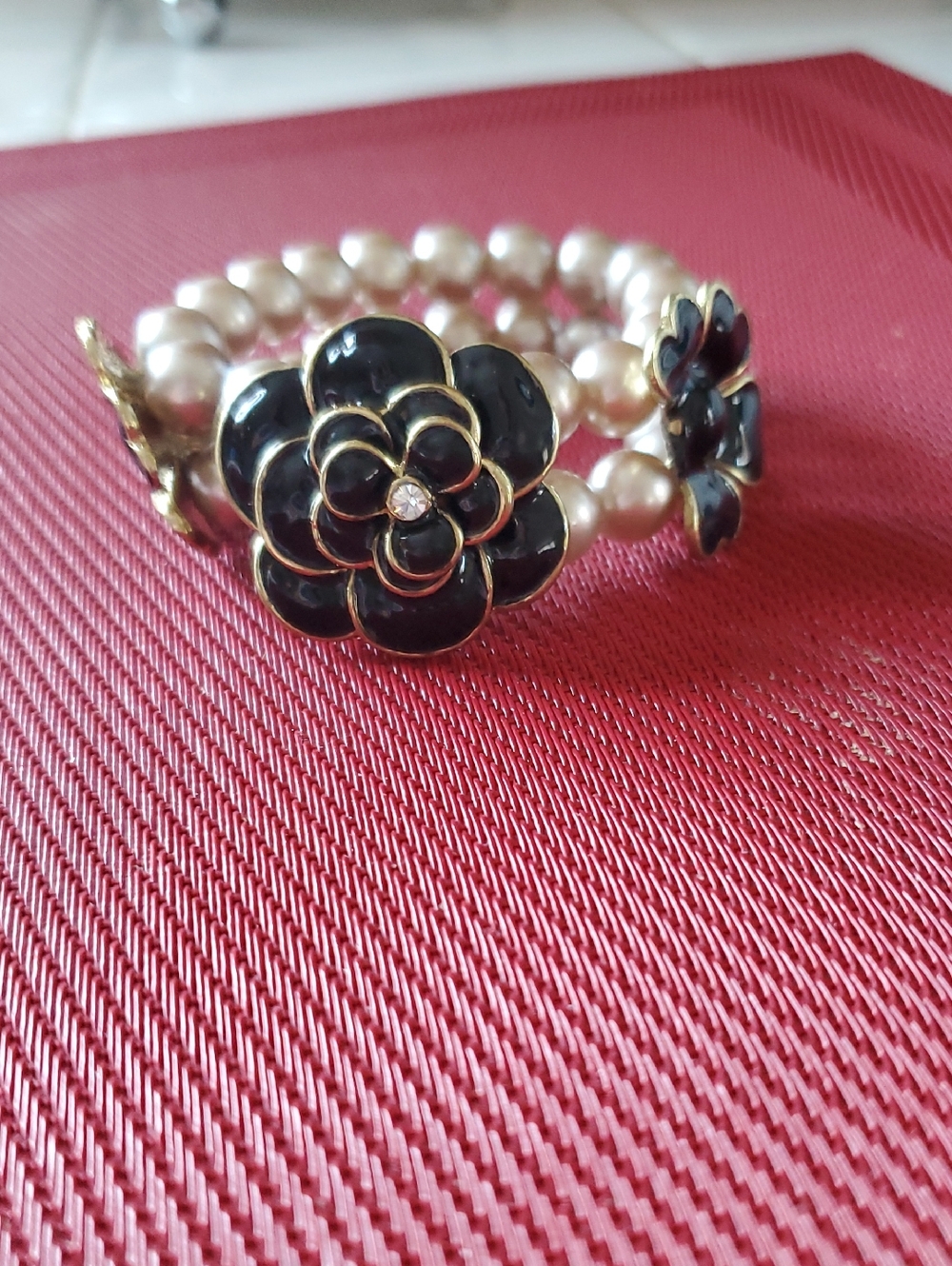 Pearl Stretch Bracelet with Black Floral Accent
